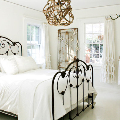 Cottage chic white floor bedroom photo in Tampa with white walls and no fireplace