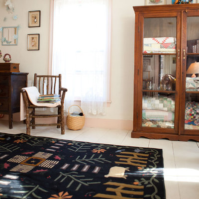 Inspiration for a country bedroom remodel in Burlington with beige walls