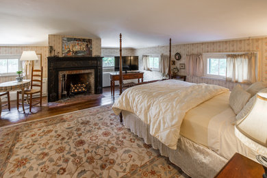 Example of a country bedroom design in New York