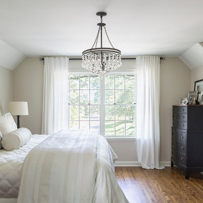Mid-sized elegant master medium tone wood floor bedroom photo in Minneapolis with no fireplace and beige walls