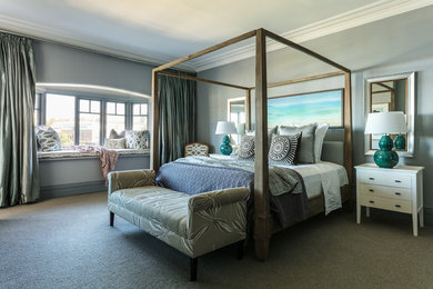 Large beach style master bedroom in Sydney with carpet and no fireplace.