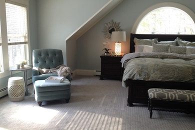 Example of a large transitional master carpeted bedroom design in Boston with blue walls and no fireplace