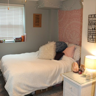 Inspiration for a mid-sized modern guest carpeted and beige floor bedroom remodel in Other with gray walls and no fireplace
