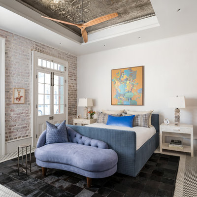 Eclectic guest bedroom photo in Houston with white walls
