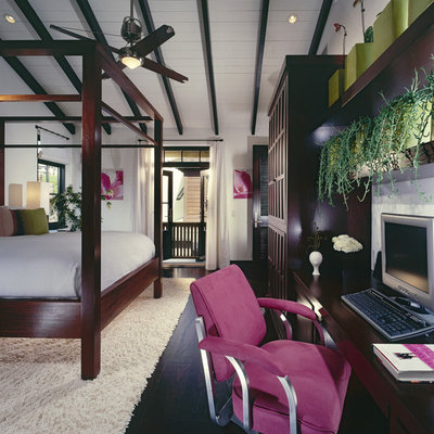 Example of an island style bedroom design in Orange County with white walls