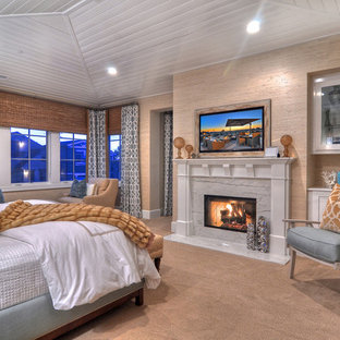 Bedroom - traditional master carpeted bedroom idea in Orange County with beige walls and a standard fireplace