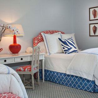 Mid-sized beach style guest carpeted bedroom photo in Miami with blue walls