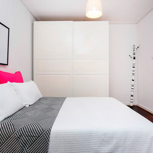 Inspiration for a contemporary guest bedroom in Adelaide with white walls, dark hardwood floors and brown floor.