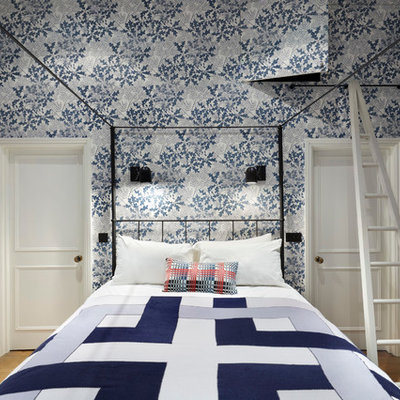 Transitional bedroom photo in London with multicolored walls