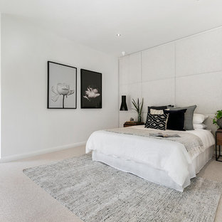Photo of a contemporary bedroom in Hobart with white walls, carpet and grey floor.