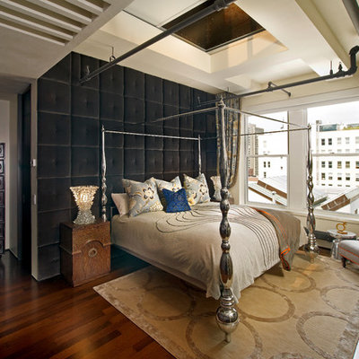 Inspiration for an eclectic dark wood floor bedroom remodel in Houston with beige walls