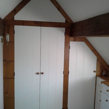 Oak framed wardrobe with hand-painted chest of drawers for an old cottage.