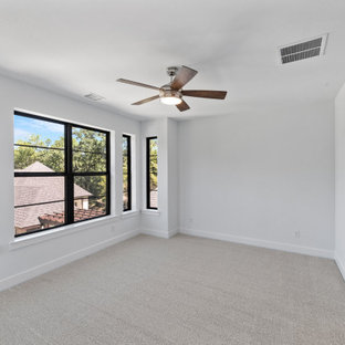 Example of a large trendy guest carpeted and gray floor bedroom design in Dallas with white walls