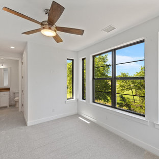 Inspiration for a large contemporary guest carpeted and gray floor bedroom remodel in Dallas with white walls
