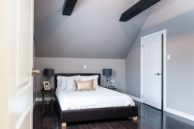 Photo of a large contemporary mezzanine bedroom in Other with beige walls and dark hardwood flooring.