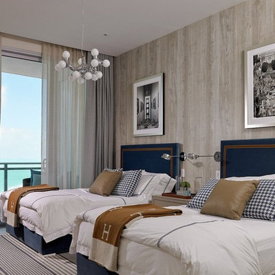 Large beach style guest carpeted and gray floor bedroom photo in Miami with brown walls and no fireplace