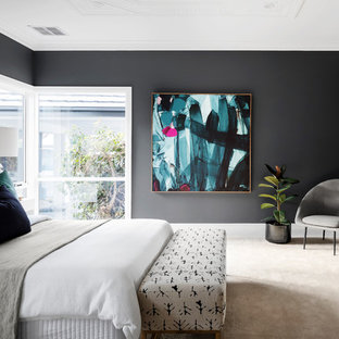 Contemporary bedroom in Melbourne with black walls, carpet and beige floor.