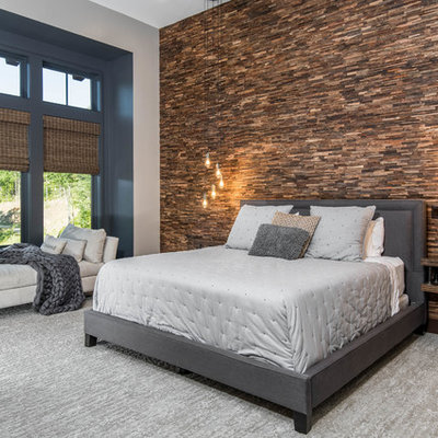 Example of a large mountain style master carpeted and gray floor bedroom design in Other with multicolored walls and no fireplace