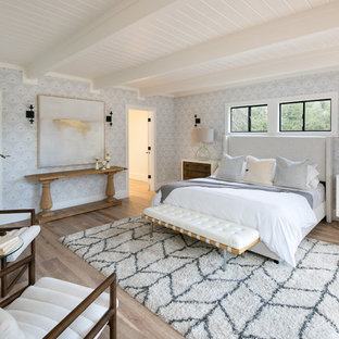 Large transitional master light wood floor and beige floor bedroom photo in San Francisco with gray walls
