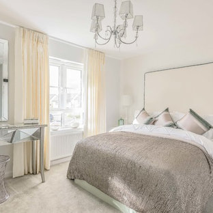 This is an example of a medium sized classic guest bedroom in Edinburgh with white walls, carpet and grey floors.