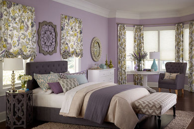 Example of a large trendy master dark wood floor and brown floor bedroom design in Los Angeles with purple walls