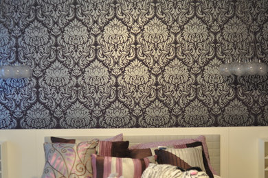 Example of a trendy bedroom design in DC Metro with purple walls