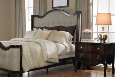 Large elegant master medium tone wood floor bedroom photo in Atlanta with beige walls and no fireplace