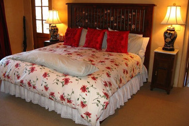 Example of a mid-sized arts and crafts master carpeted bedroom design in Albuquerque with beige walls