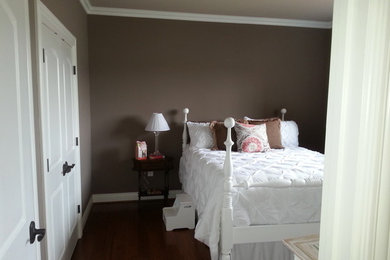 Inspiration for a large timeless master dark wood floor and brown floor bedroom remodel in Other with gray walls