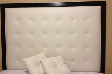 Elegant bedroom photo in Houston with brown walls