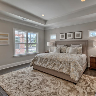 Inspiration for a mid-sized timeless master dark wood floor bedroom remodel in San Diego with beige walls