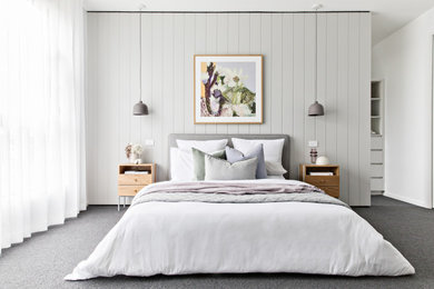 Imagen de dormitorio escandinavo con paredes grises, moqueta y suelo gris