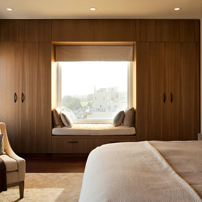 Inspiration for a modern dark wood floor bedroom remodel in San Francisco with beige walls