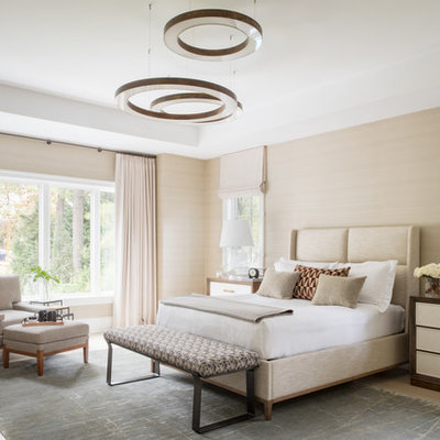 Large trendy master light wood floor and beige floor bedroom photo in DC Metro with beige walls