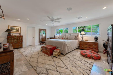 Photo of a medium sized eclectic master bedroom in Los Angeles with white walls.