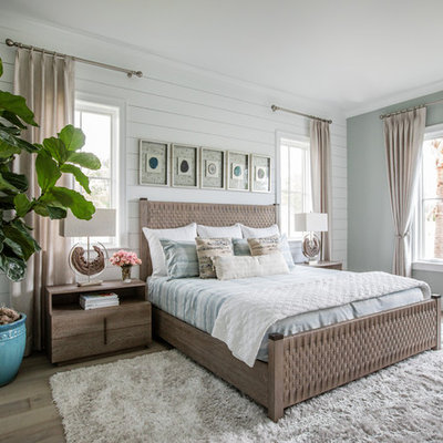 Bedroom - coastal master light wood floor and beige floor bedroom idea in Jacksonville with white walls and no fireplace
