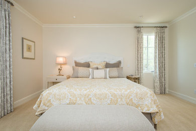 Example of a transitional guest bedroom design in Phoenix with beige walls