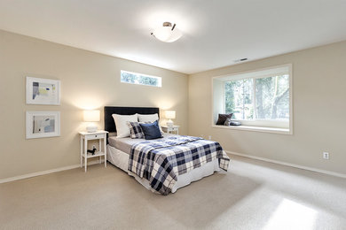 Photo of a large classic bedroom in Portland with carpet and beige floors.
