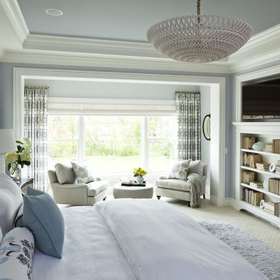 Huge elegant master carpeted bedroom photo in Minneapolis with no fireplace and blue walls