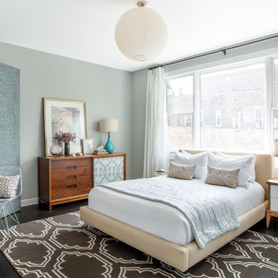 Inspiration for a transitional dark wood floor and brown floor bedroom remodel in Chicago with green walls