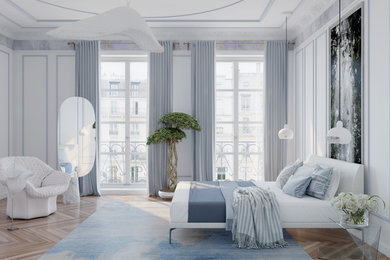 Imagen de dormitorio principal moderno de tamaño medio con paredes blancas, suelo de madera clara y suelo beige