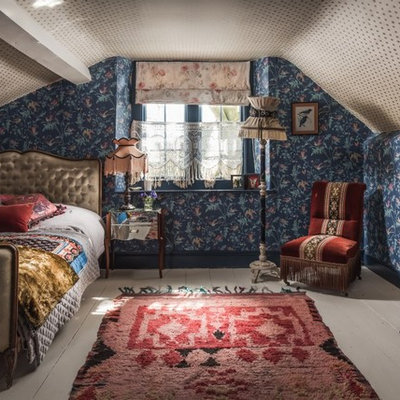 Mid-sized elegant painted wood floor and white floor bedroom photo in Other with blue walls
