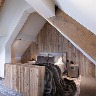 Design ideas for a large rustic guest bedroom in Cheshire with white walls, carpet, no fireplace and brown floors.
