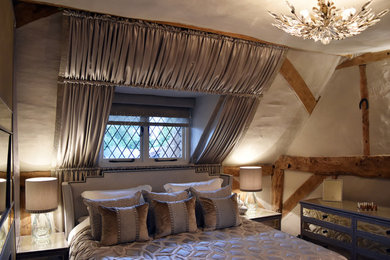 Small traditional master bedroom in Hertfordshire with beige walls, carpet and beige floors.