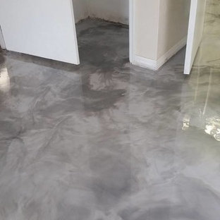 Foto de habitación de invitados actual, de tamaño medio, con suelo de cemento