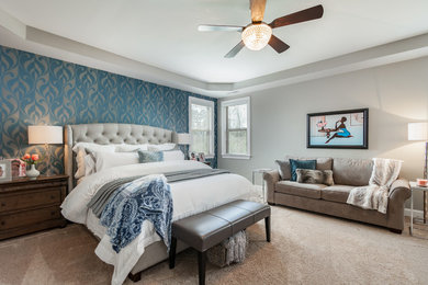 Example of a mid-sized trendy master carpeted and white floor bedroom design in Raleigh with gray walls