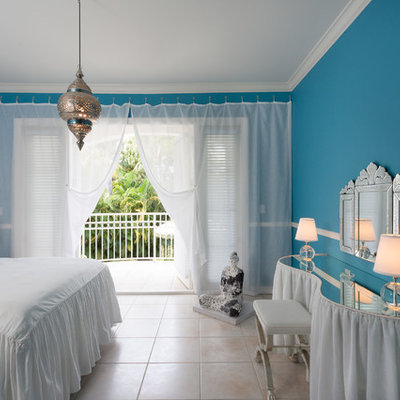 Island style bedroom photo in Miami with blue walls