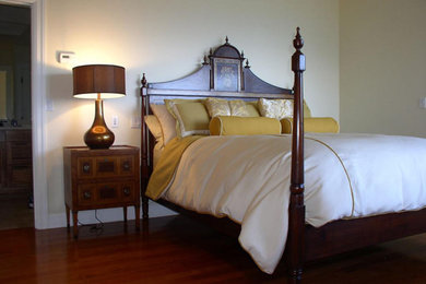 Mid-sized beach style guest dark wood floor and brown floor bedroom photo in Portland with beige walls and no fireplace