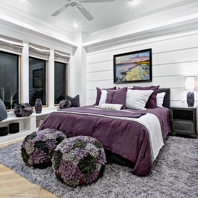 Inspiration for a coastal light wood floor bedroom remodel in Jacksonville with white walls and no fireplace