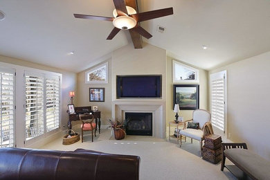 Bedroom - large master carpeted bedroom idea in Kansas City with white walls, a standard fireplace and a stone fireplace